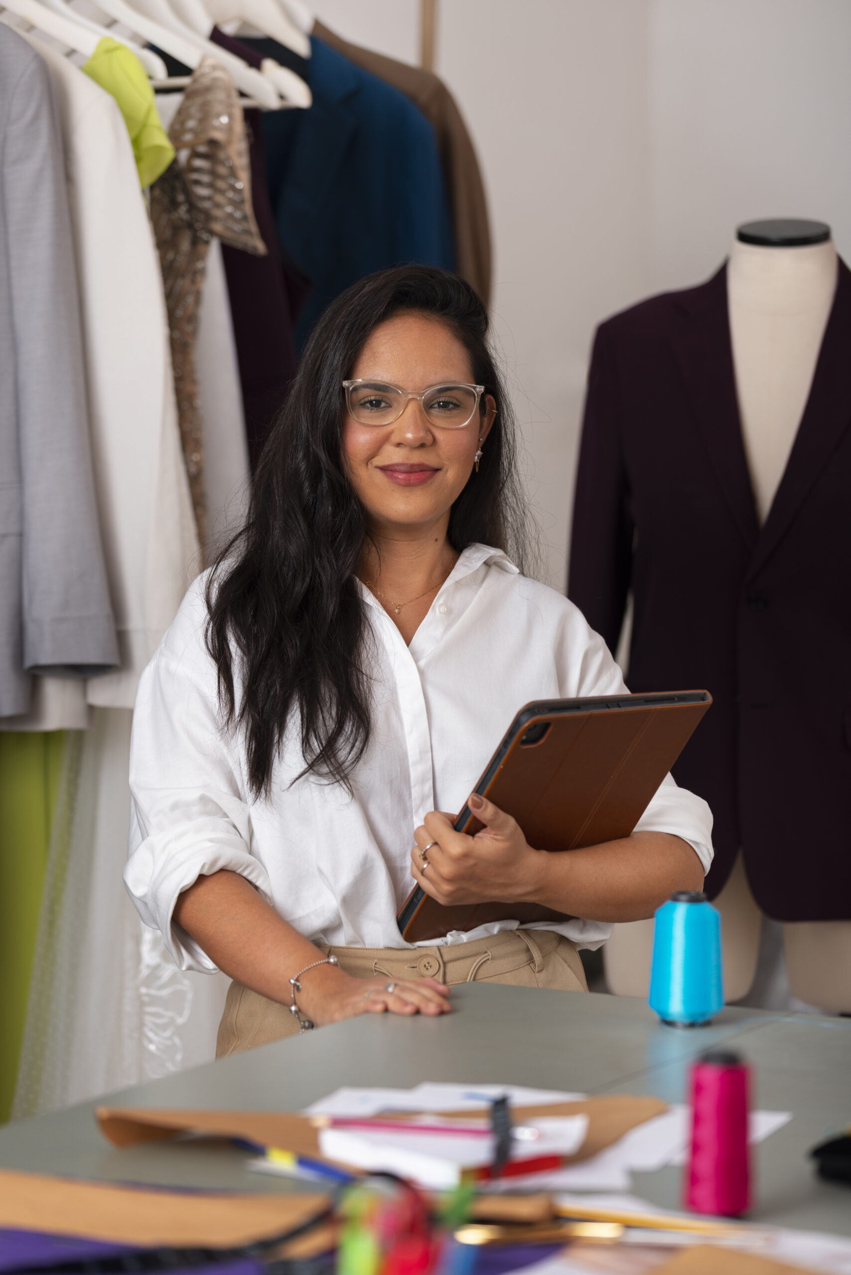 front view brazilian woman working as clothing designer